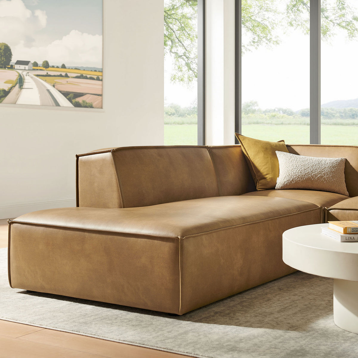 Close-up of the chaise end of the toast vegan leather sectional emphasizing its smooth tailored cushions || EEI-7420-TST || detail_room