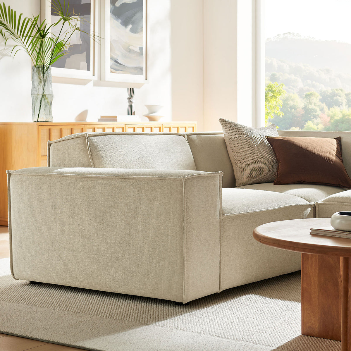Left-arm end of the modular sectional in a serene living room, showcasing tailored lines and soft texture || EEI-7421-ECR || front_angle_partial_room