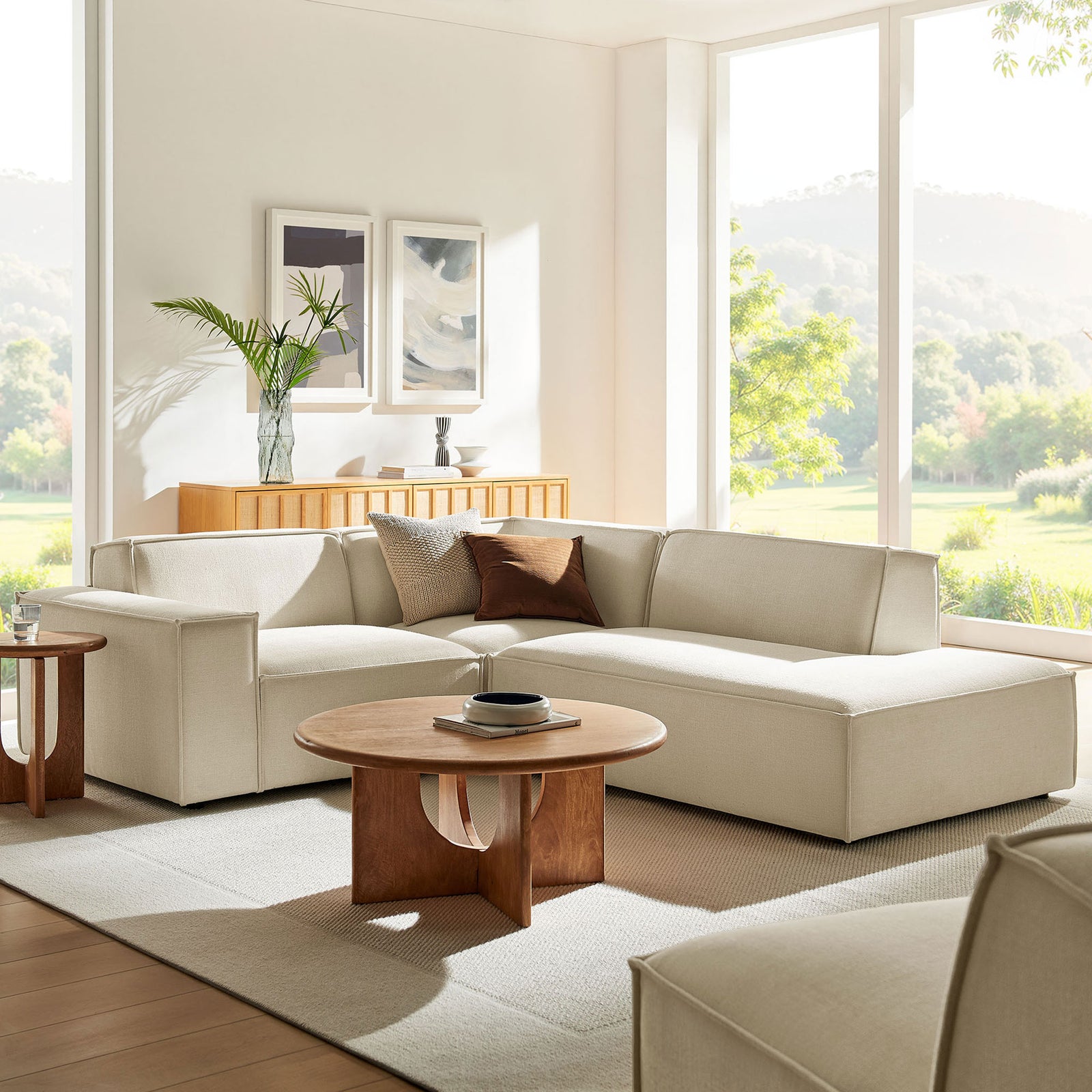 Neutral ecru modular sectional styled in a bright living room with layered pillows and warm wood accents || EEI-7421-ECR || front_angle_room