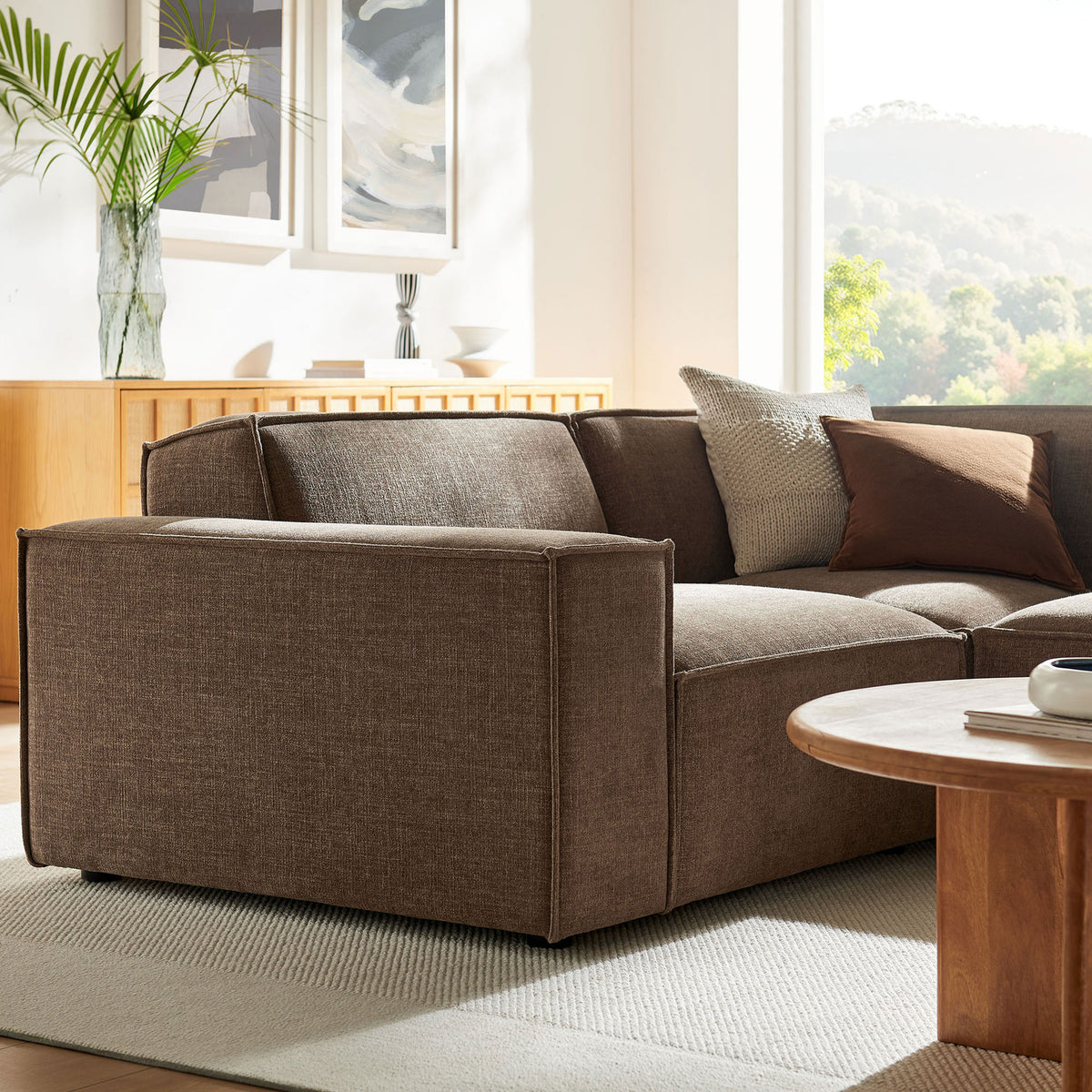 Wide track arm and padded backrest showcase the clean tailoring and rich mocha weave of the Restore sectional || EEI-7421-MOC || detail_room
