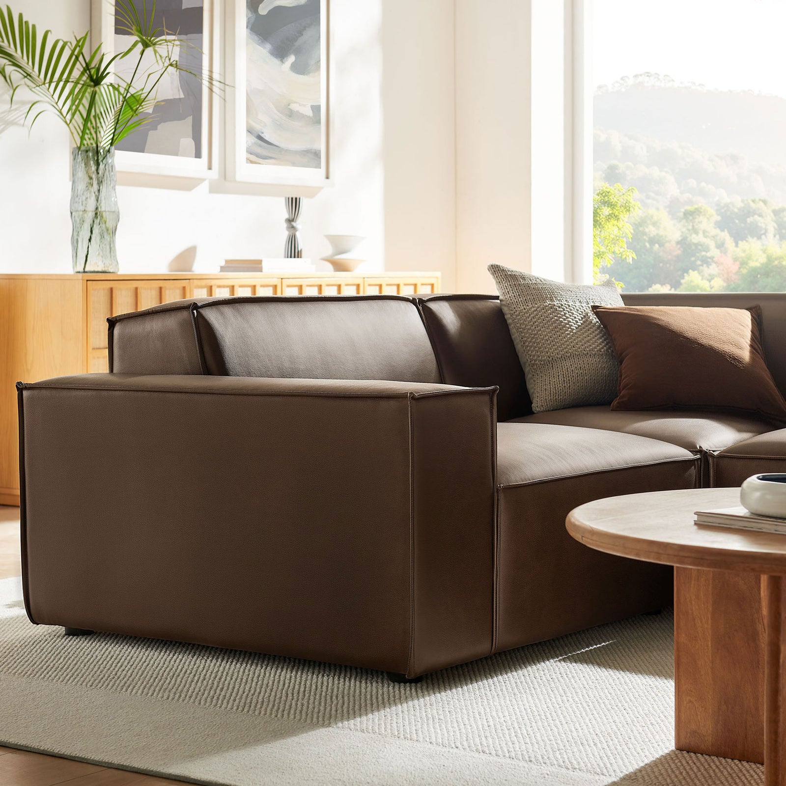 Close-up of espresso vegan leather arm and seat showing soft cushioning and stitching || EEI-7422-ESP || detail_room