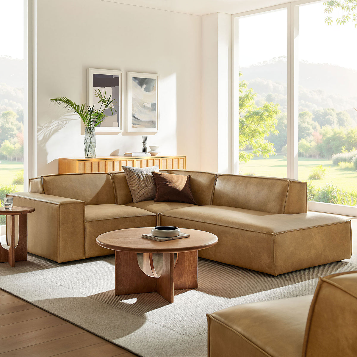 Toast vegan leather right-facing L-shaped sectional styled in a bright modern living room with wood accents || EEI-7422-TST || front_angle_room