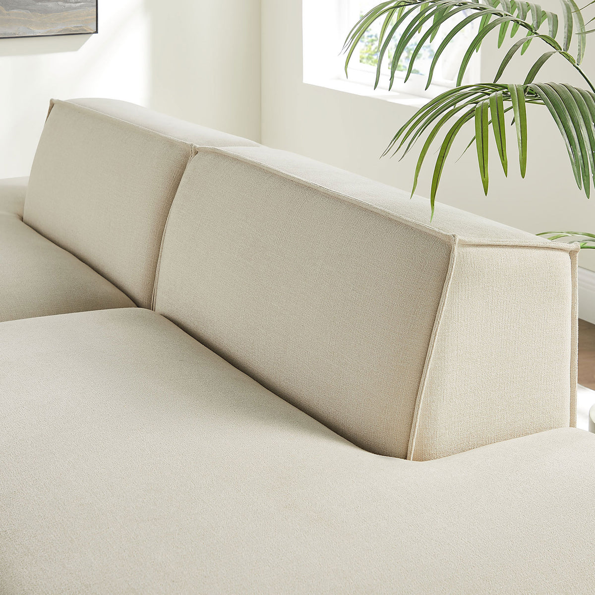 Tailored split back cushions with refined French piping highlighting the clean modern lines of the modular loveseat || EEI-7423-ECR || detail_room
