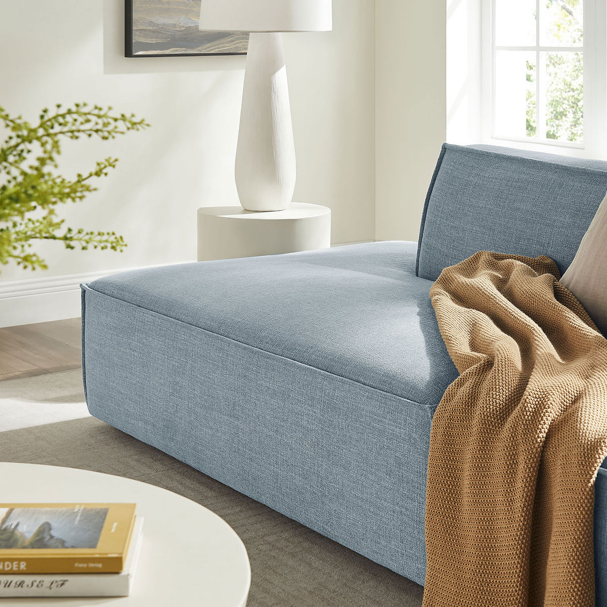 Sky blue chaise lounge seat styled with a warm knit throw on soft textured fabric || EEI-7423-SKY || detail_room