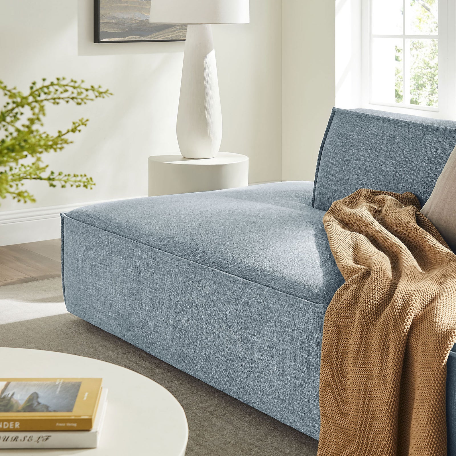 Sky blue chaise lounge seat styled with a warm knit throw on soft textured fabric || EEI-7423-SKY || detail_room