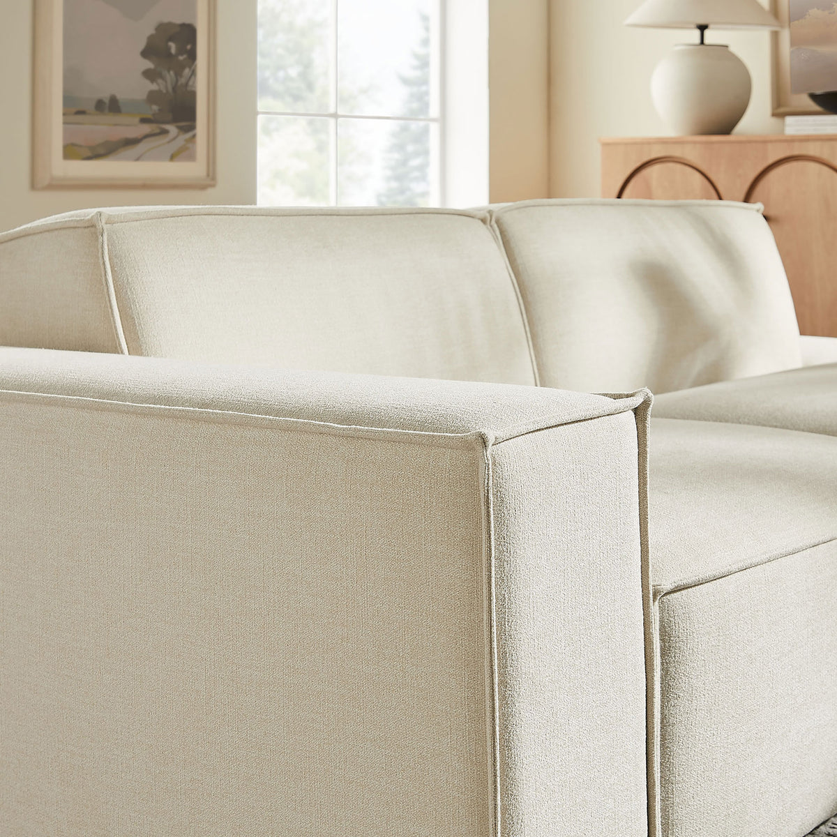 Left armrest and back cushions highlight the loveseat's smooth, performance fabric finish || EEI-7425-ECR || detail_room