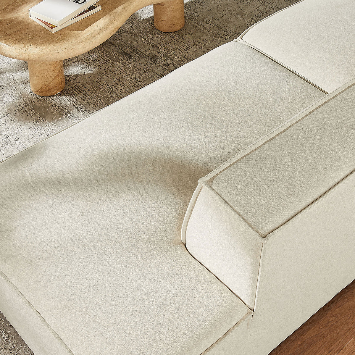 Soft, generously padded chaise cushion displays the loveseat's cozy comfort and stain-resistant fabric || EEI-7425-ECR || detail_room