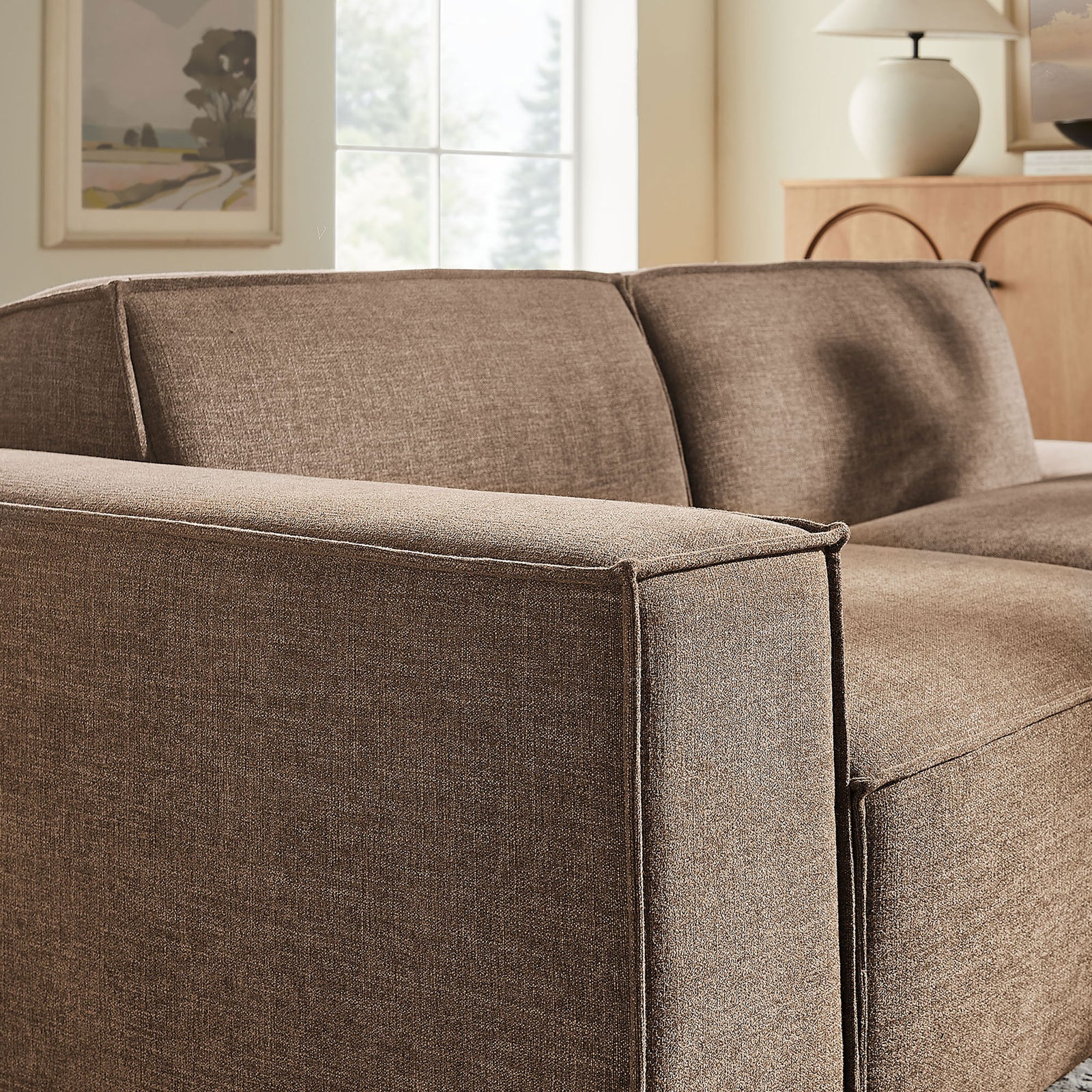 Left armrest with tailored French piping in a warm mocha performance fabric || EEI-7425-MOC || detail_room
