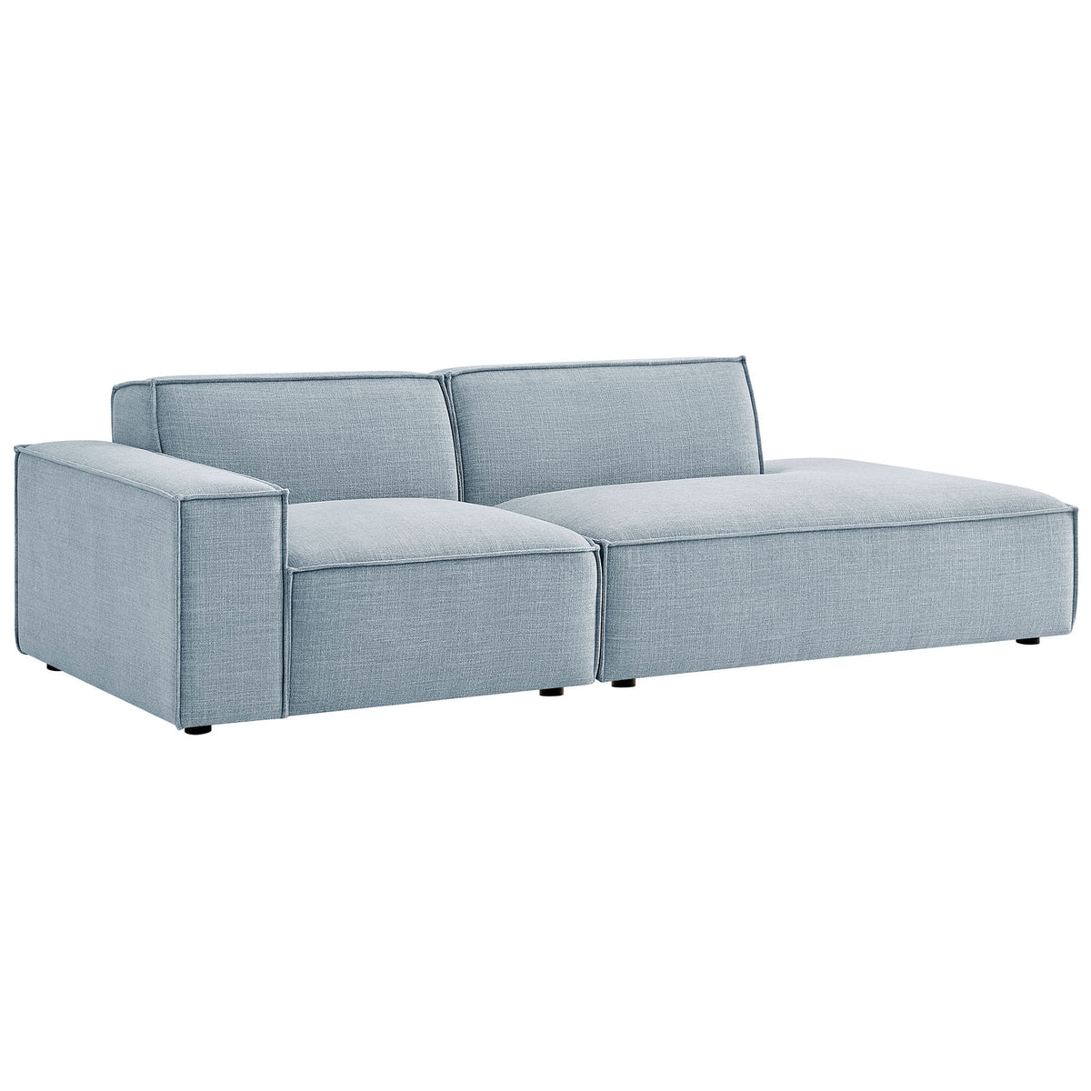 Low profile sky blue modular loveseat with deep cushions and wide chaise for relaxed lounging || EEI-7425-SKY || front_angle_studio