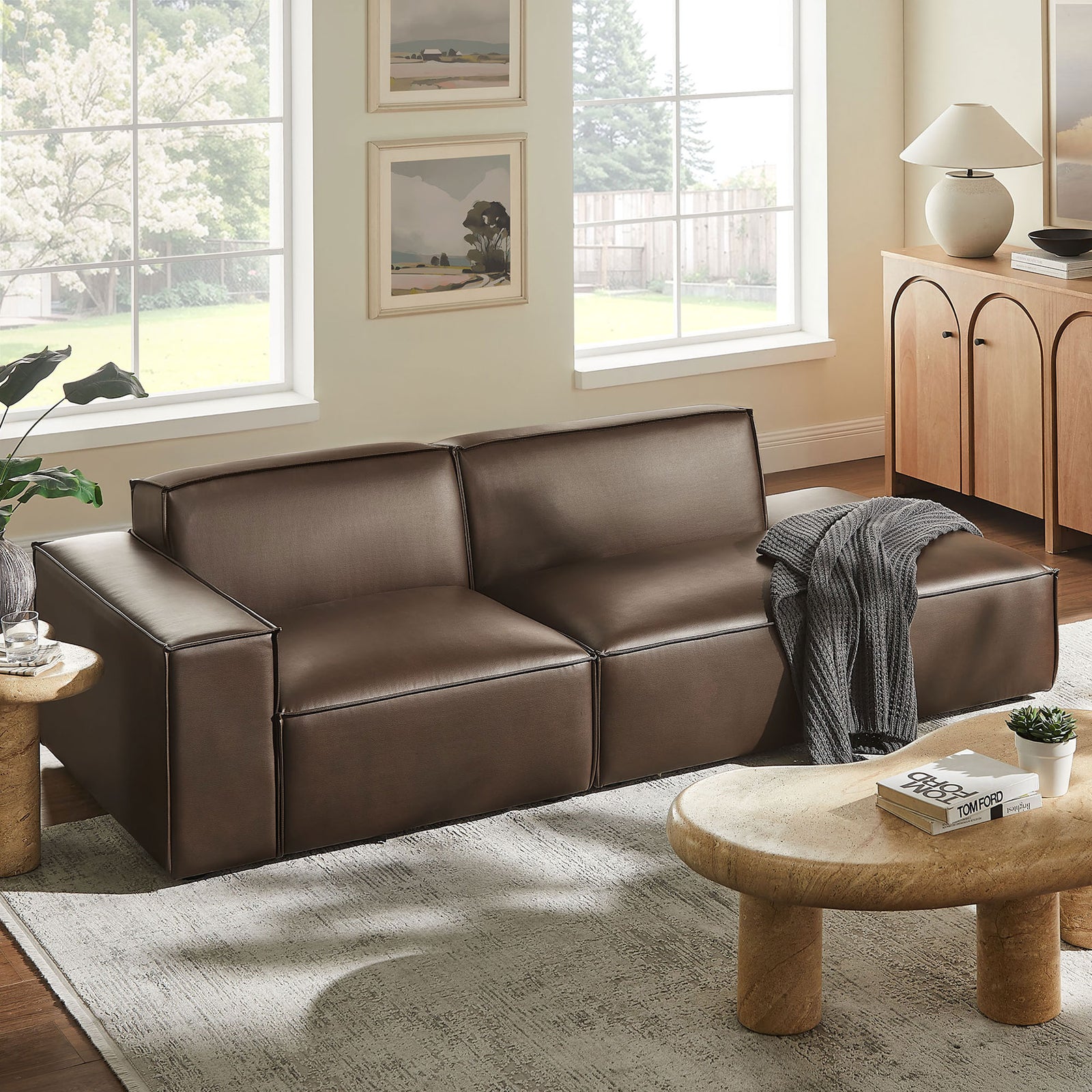 Espresso vegan leather modular loveseat creating a cozy lounge spot in a warm living room || EEI-7426-ESP || front_angle_room