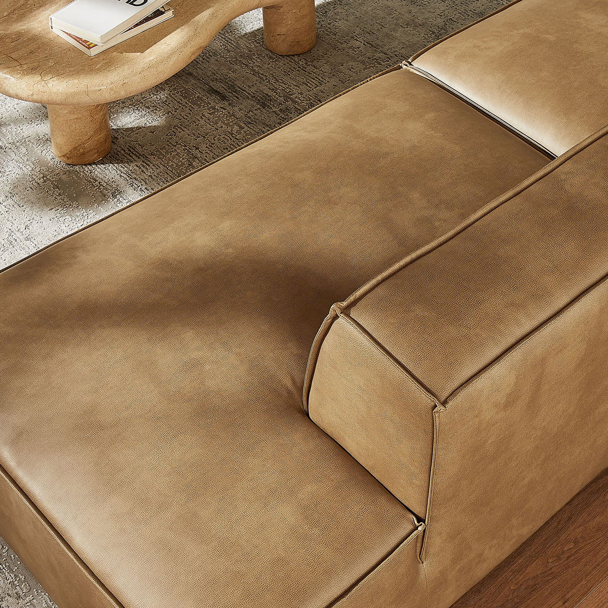 Chaise seat surface emphasizing the smooth toast vegan leather and subtle tonal shading. || EEI-7426-TST || swatch_room