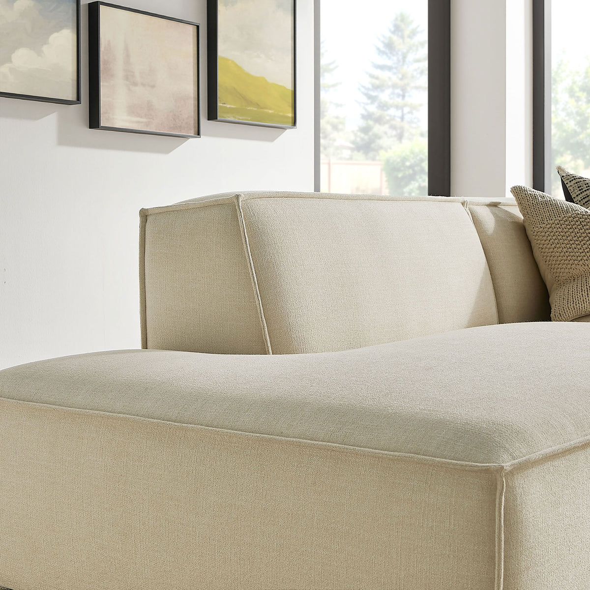 Curved chaise cushion and backrest emphasize the sofa's sculpted lines and cozy, supportive feel || EEI-7427-ECR || detail_room