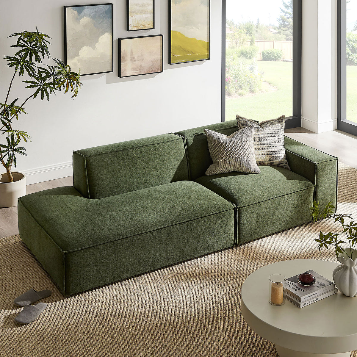 Foliage green modular loveseat styled with pillows in a sunlit room for an inviting lounge corner || EEI-7427-FOL || front_angle_room