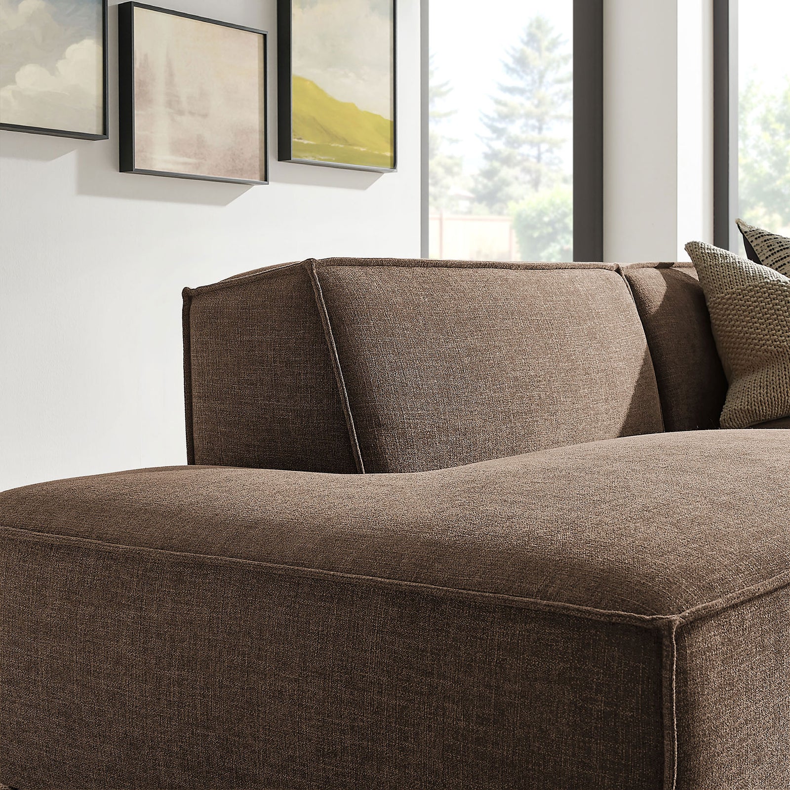Curved back cushion and soft mocha upholstery creating a cozy, enveloping lounge feel || EEI-7427-MOC || detail_room