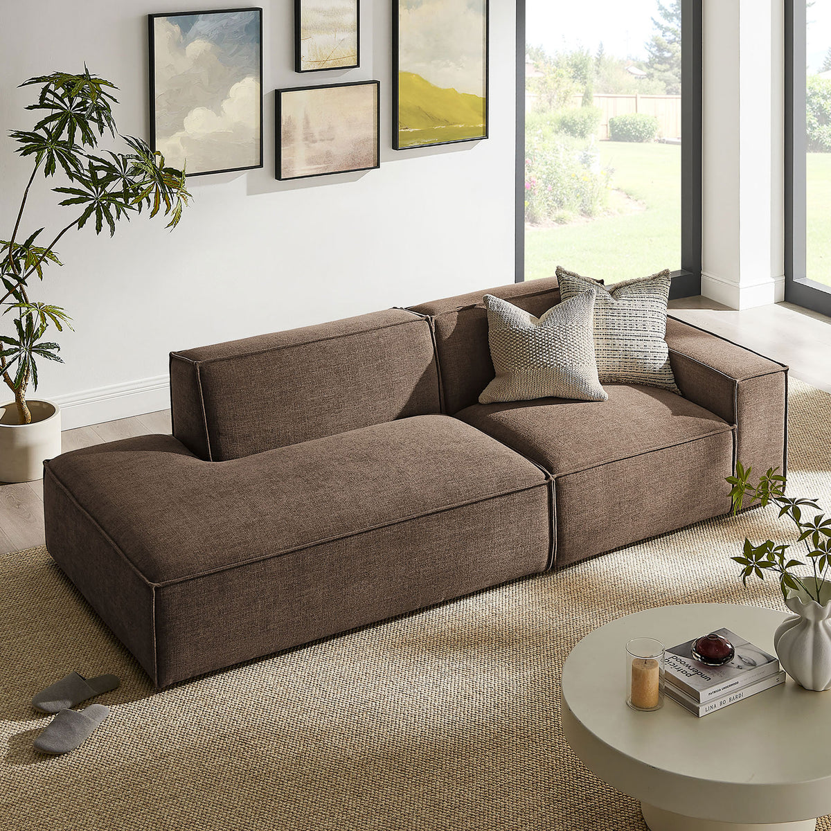 Mocha modular loveseat arranged in a sunny living room with neutral rug and modern decor || EEI-7427-MOC || front_angle_room