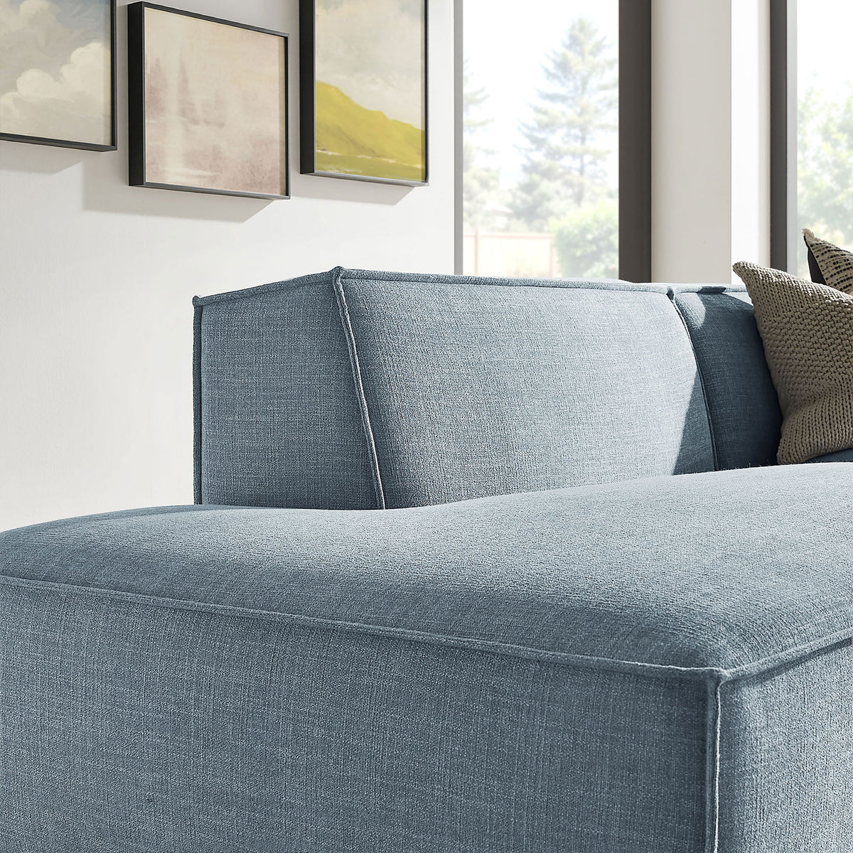 Plush sky blue chaise cushion and welted seams bring soft texture and modern style to the lounge area || EEI-7427-SKY || detail_room