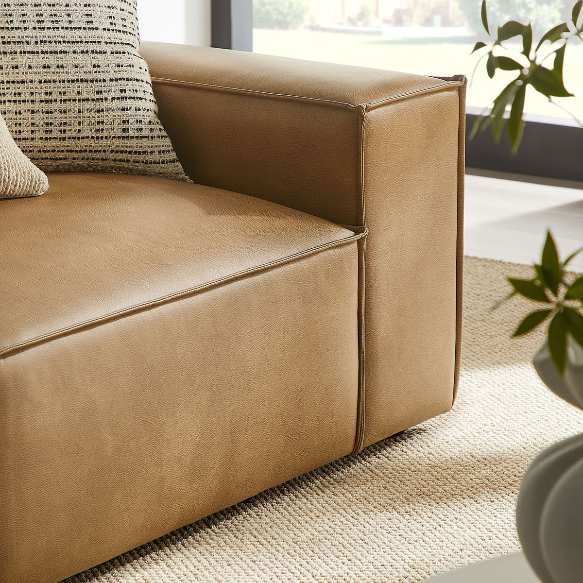 Block arm showing the tailored piping, rich toast vegan leather, and contemporary silhouette. || EEI-7428-TST || swatch_room