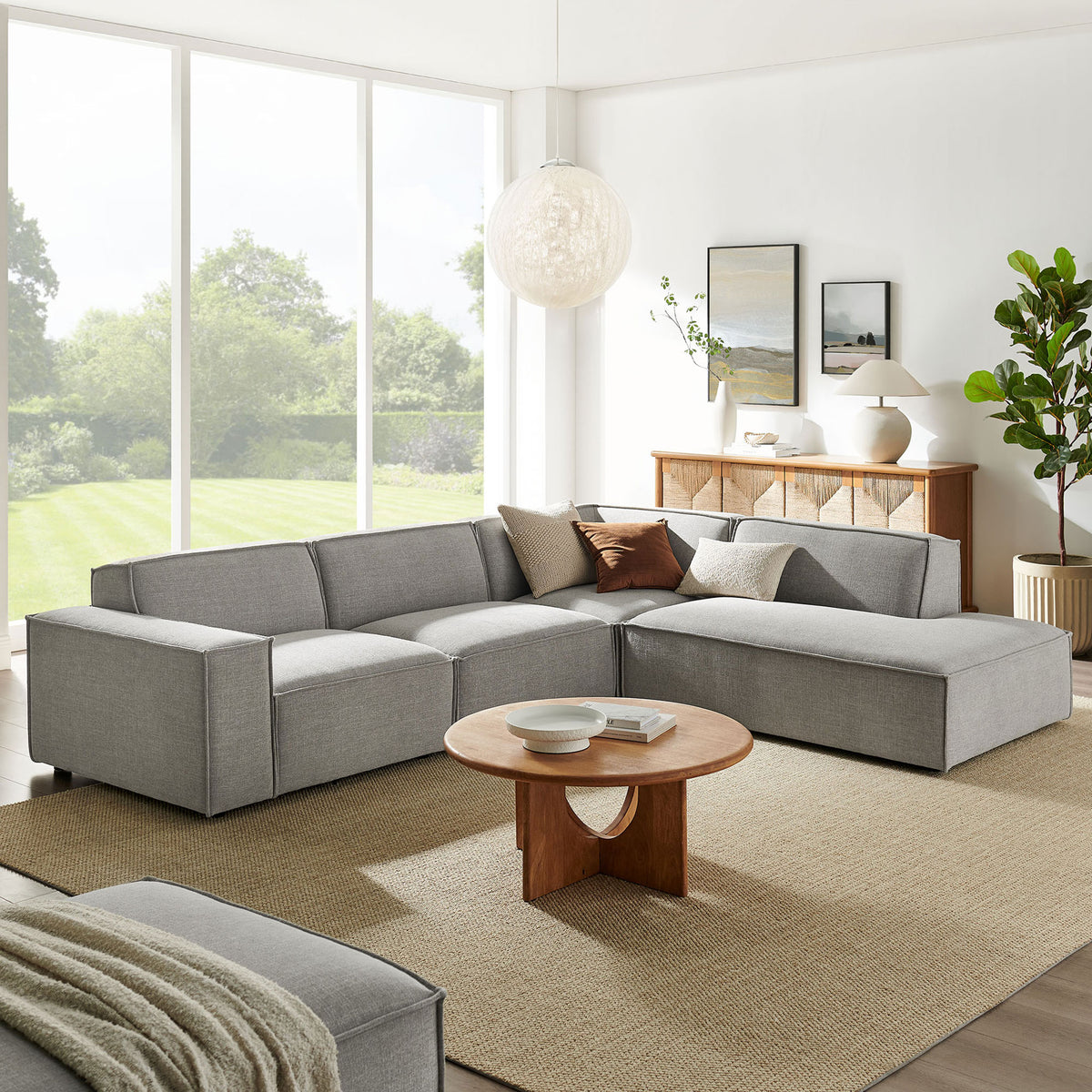 Pewter L-shaped sectional with right chaise styled in a bright living room with warm wood accents || EEI-7429-PEW || front_room
