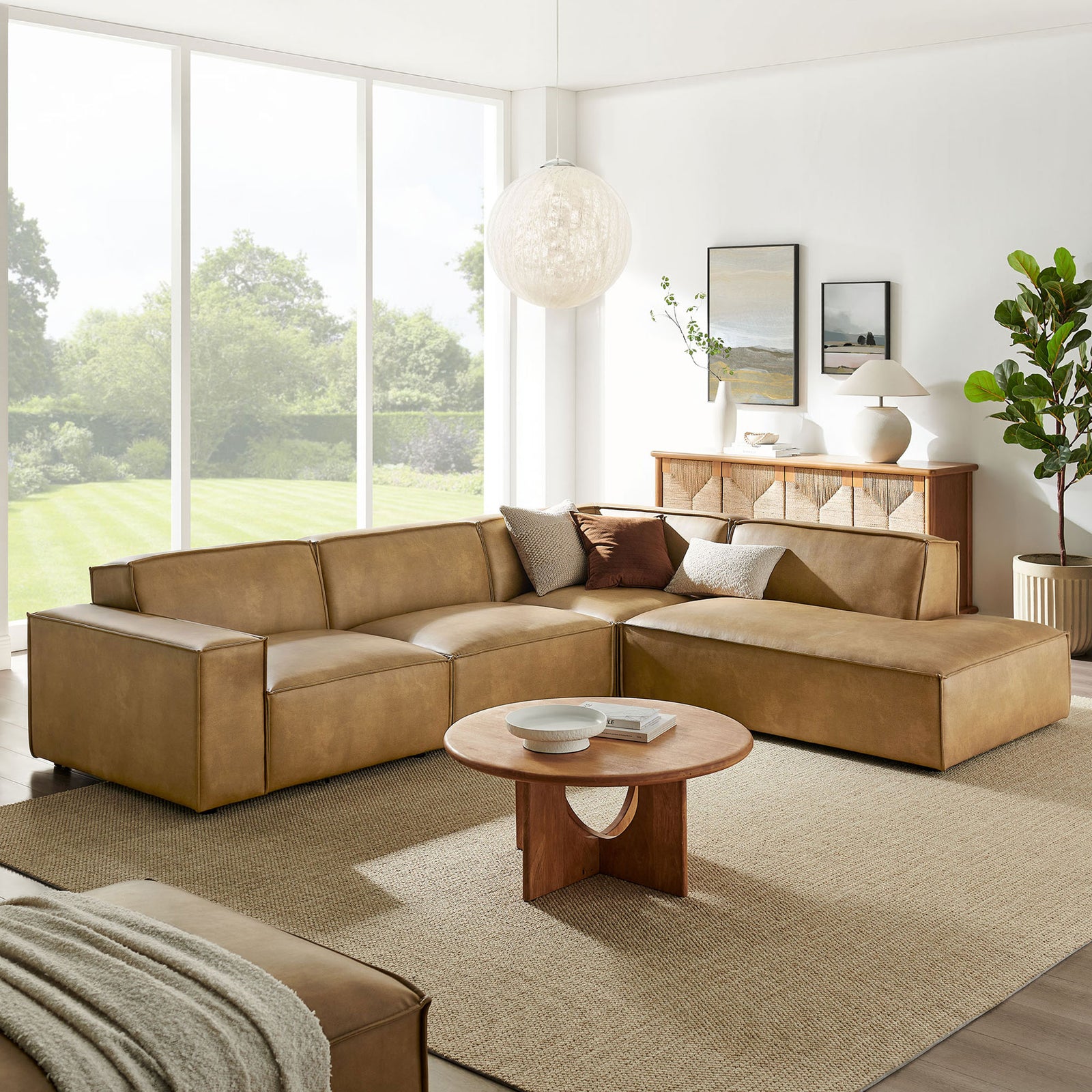 Toast vegan leather sectional with right chaise styled in an airy living room with neutral decor || EEI-7430-TST || front_room