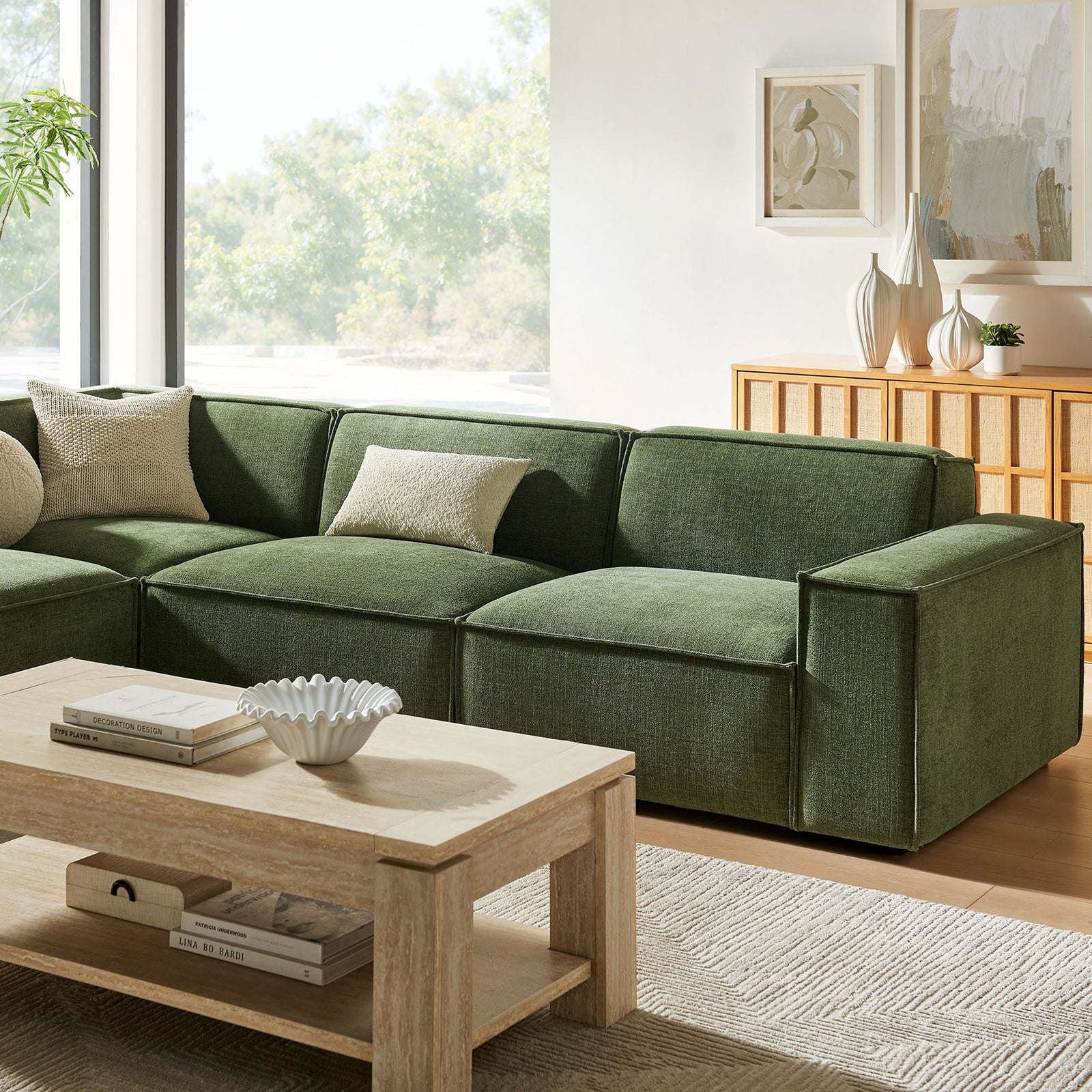 Restore foliage green modular sectional cushions with tailored piping, soft throw pillows, and inviting lounge seating || EEI-7431-FOL || detail_room