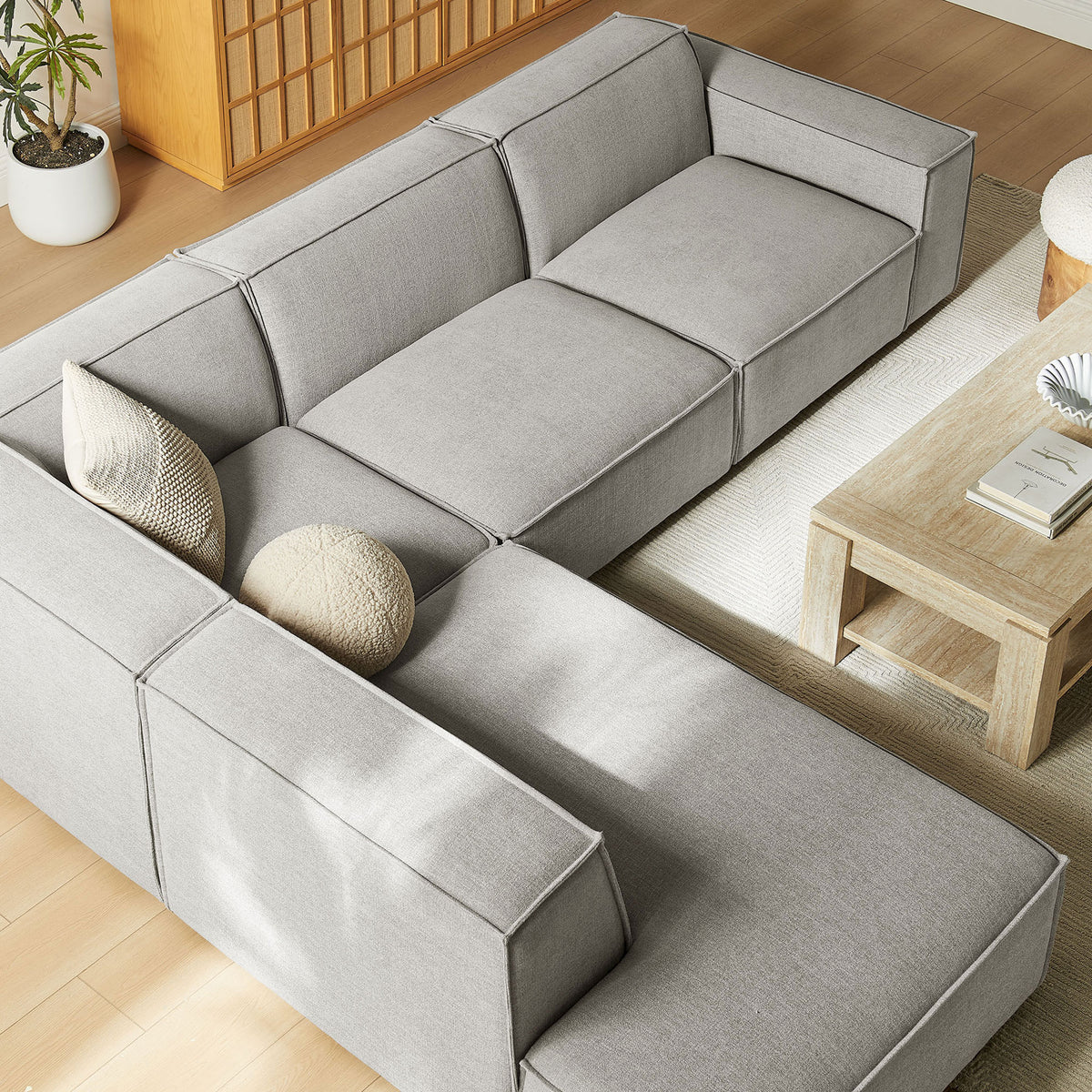 Deep modular seats and extra-wide chaise create a relaxed lounging spot on this pewter sectional || EEI-7431-PEW || top_angle_room
