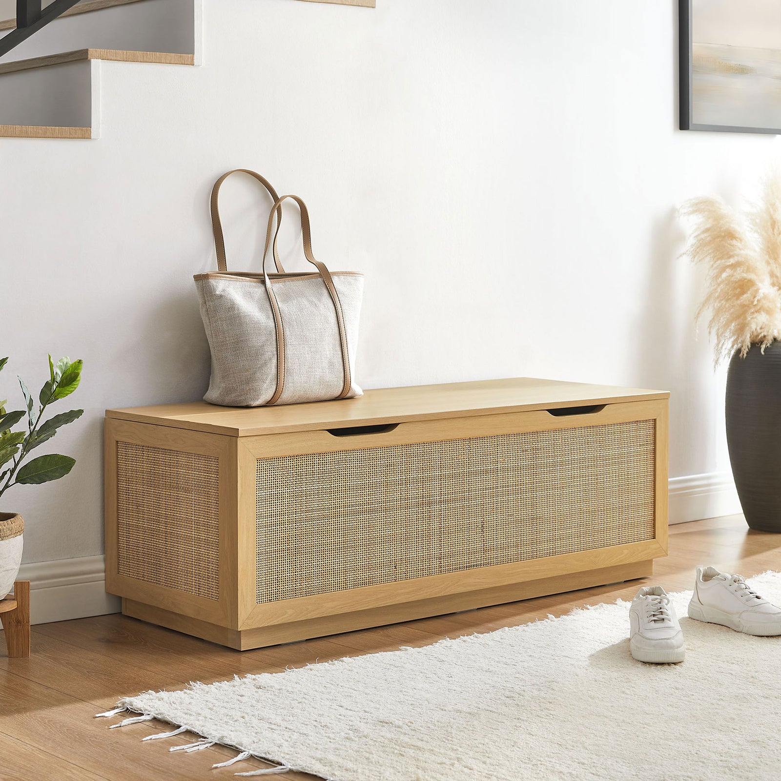 Versatile faux rattan storage bench anchors an entry with a warm oak finish and low plinth base || EEI-7434-OAK || front_angle_room