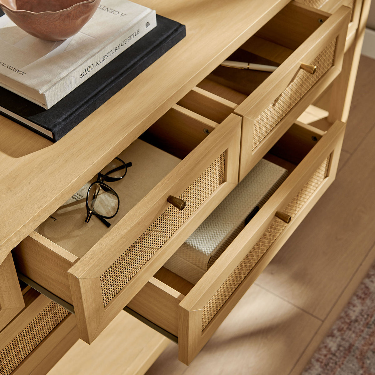 Open drawers keep daily essentials tidy while the broad tabletop displays decor || EEI-7435-OAK || storage_open_room