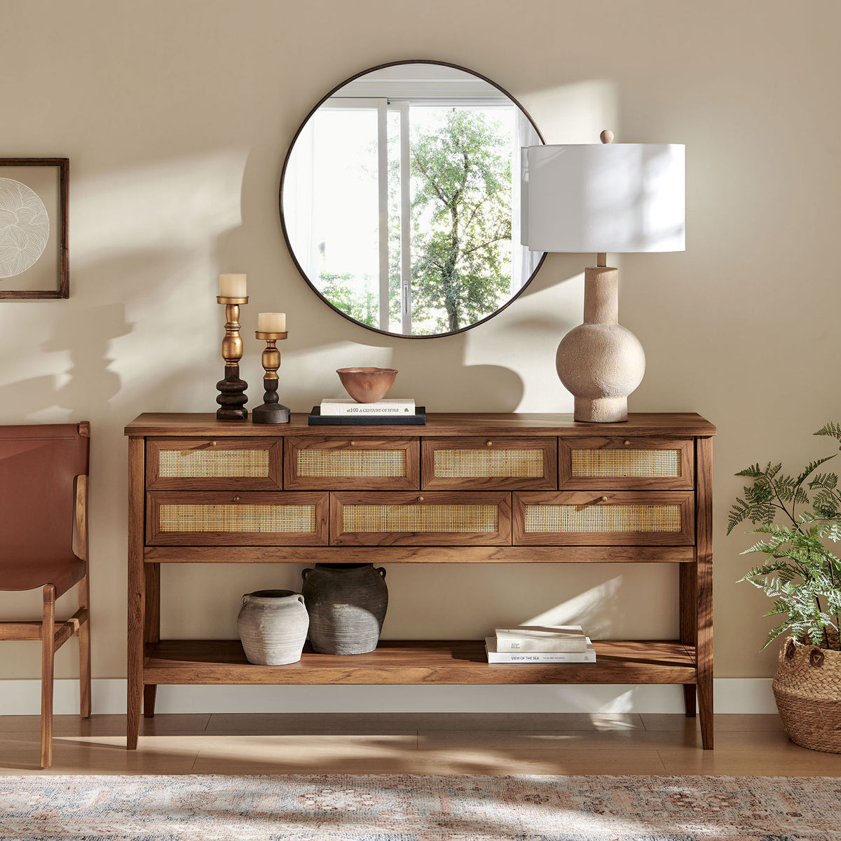 Styled console table anchors an entry with warm walnut tones, woven drawer fronts, and a versatile open shelf || EEI-7435-WAL || front_room