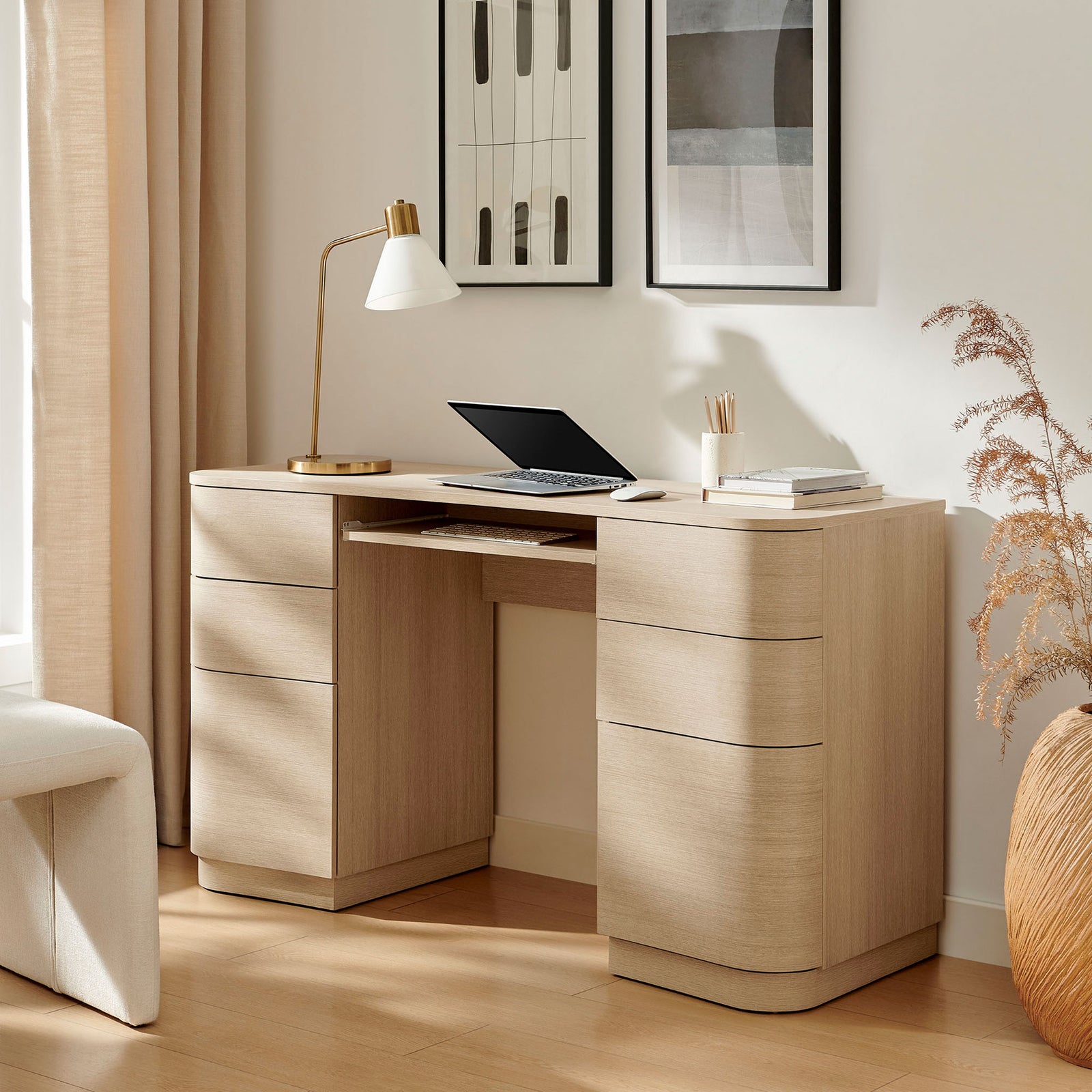Modern light oak desk with rounded edges, six drawers, and an extended keyboard tray for daily workflows. || EEI-7436-BOA || front_angle_open_room
