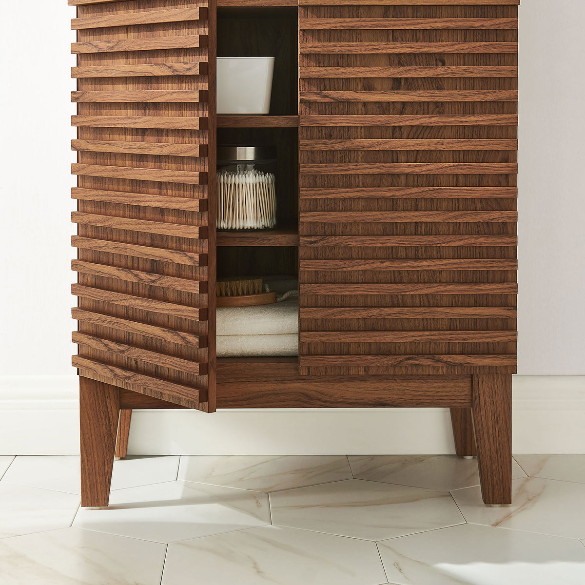 Textured slatted doors and tapered legs bring warmth to bath decor while keeping everyday items within reach || EEI-7439-WAL || detail_room