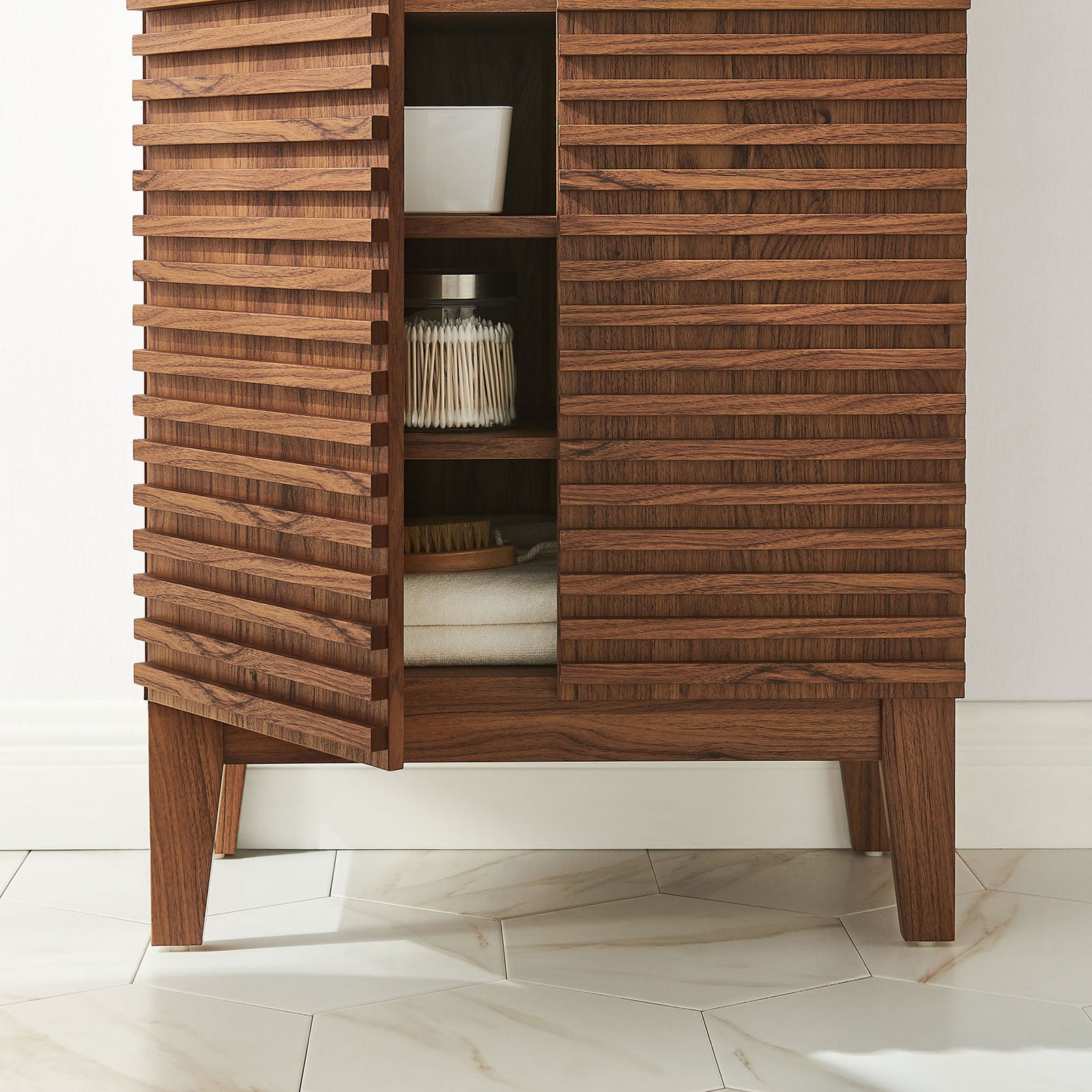 Textured slatted doors and tapered legs bring warmth to bath decor while keeping everyday items within reach || EEI-7439-WAL || detail_room