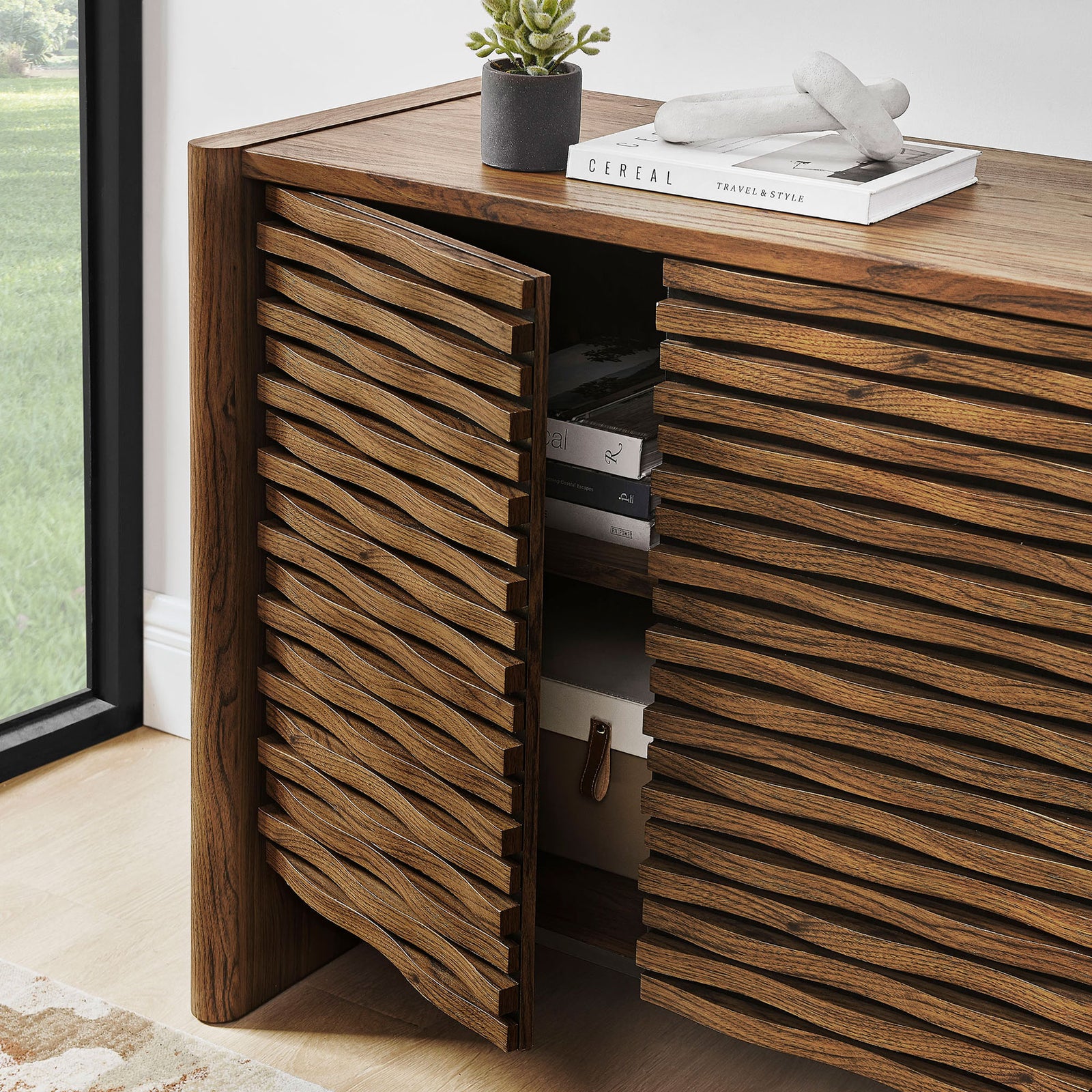 Walnut cabinet door swings open to reveal hidden shelving for books, decor, and essentials. || EEI-7444-WAL || front_angle_open_room