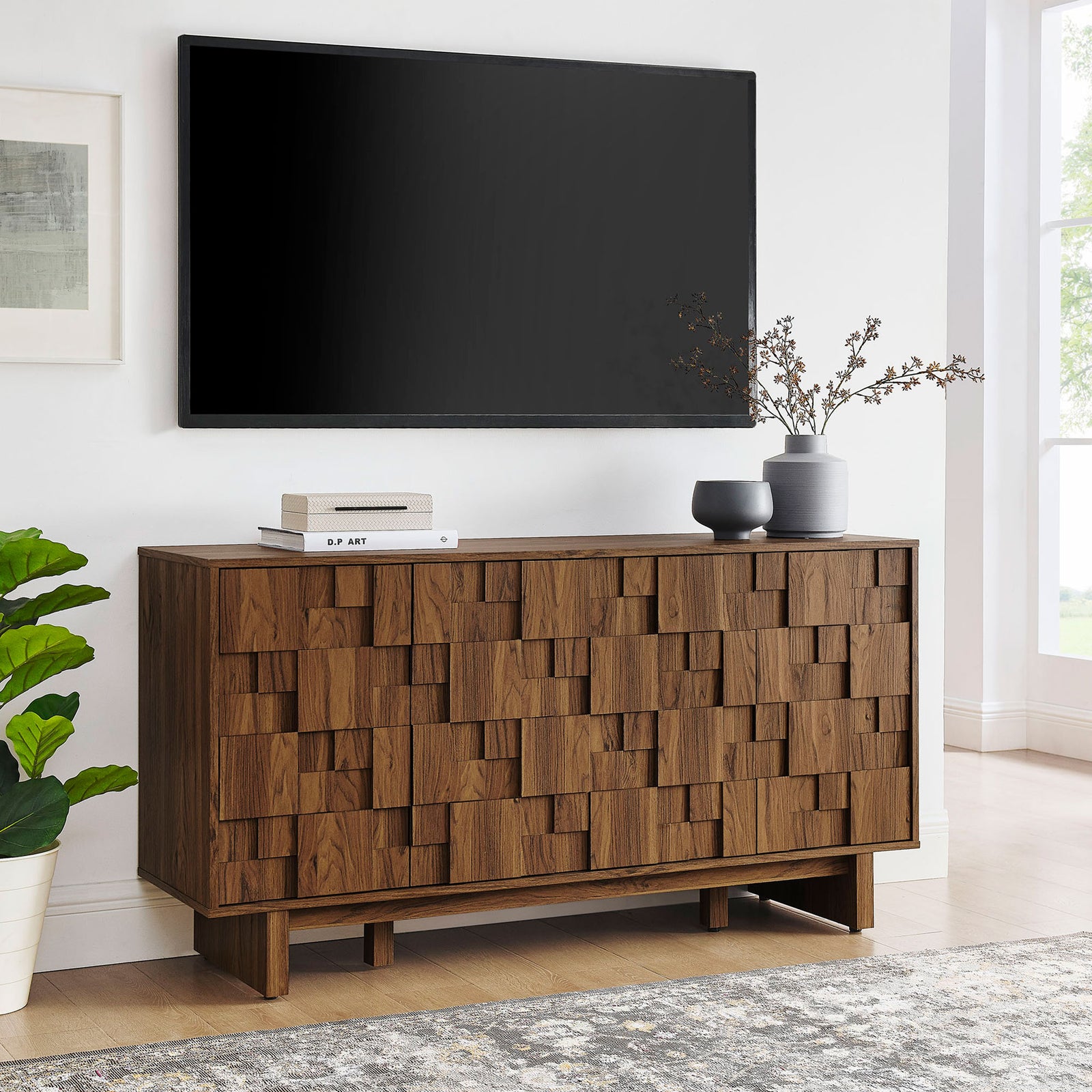 Walnut geometric sideboard used as a media console beneath a wall mounted TV || EEI-7448-WAL || front_angle_room