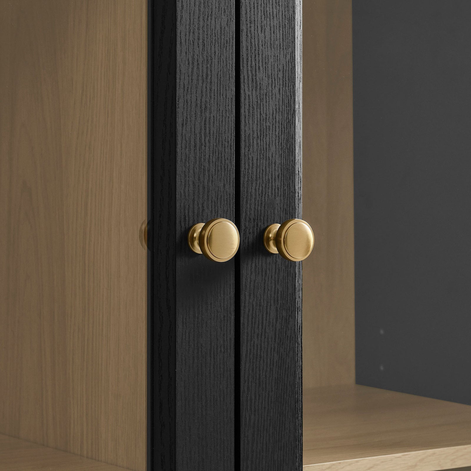 Brass finish knobs set against the black oak frame for a refined, modern finishing touch || EEI-7449-BLK-OAK || handle_studio