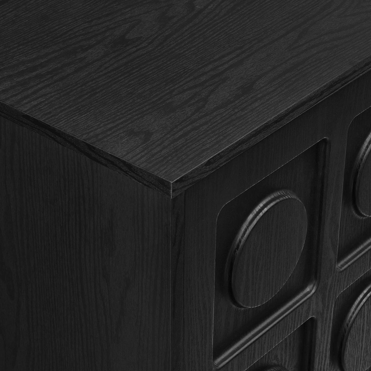 Textured black wood grain and raised circular door paneling on Knox TV stand top corner || EEI-7450-BLK || detail_studio