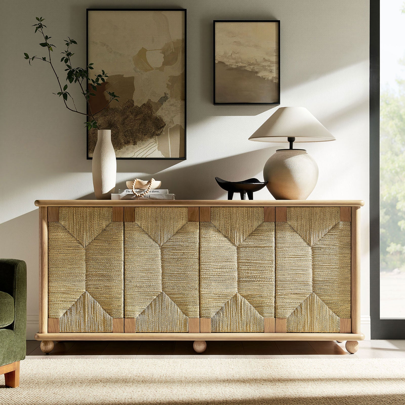 Oak and seagrass sideboard styled with decor in a sunlit modern living room for airy storage || EEI-7451-OAK || front_angle_room