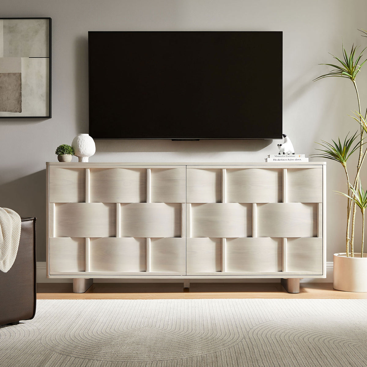 White-wash buffet cabinet used as a media console beneath a wall-mounted TV in a bright living space || EEI-7452-WWA || front_room