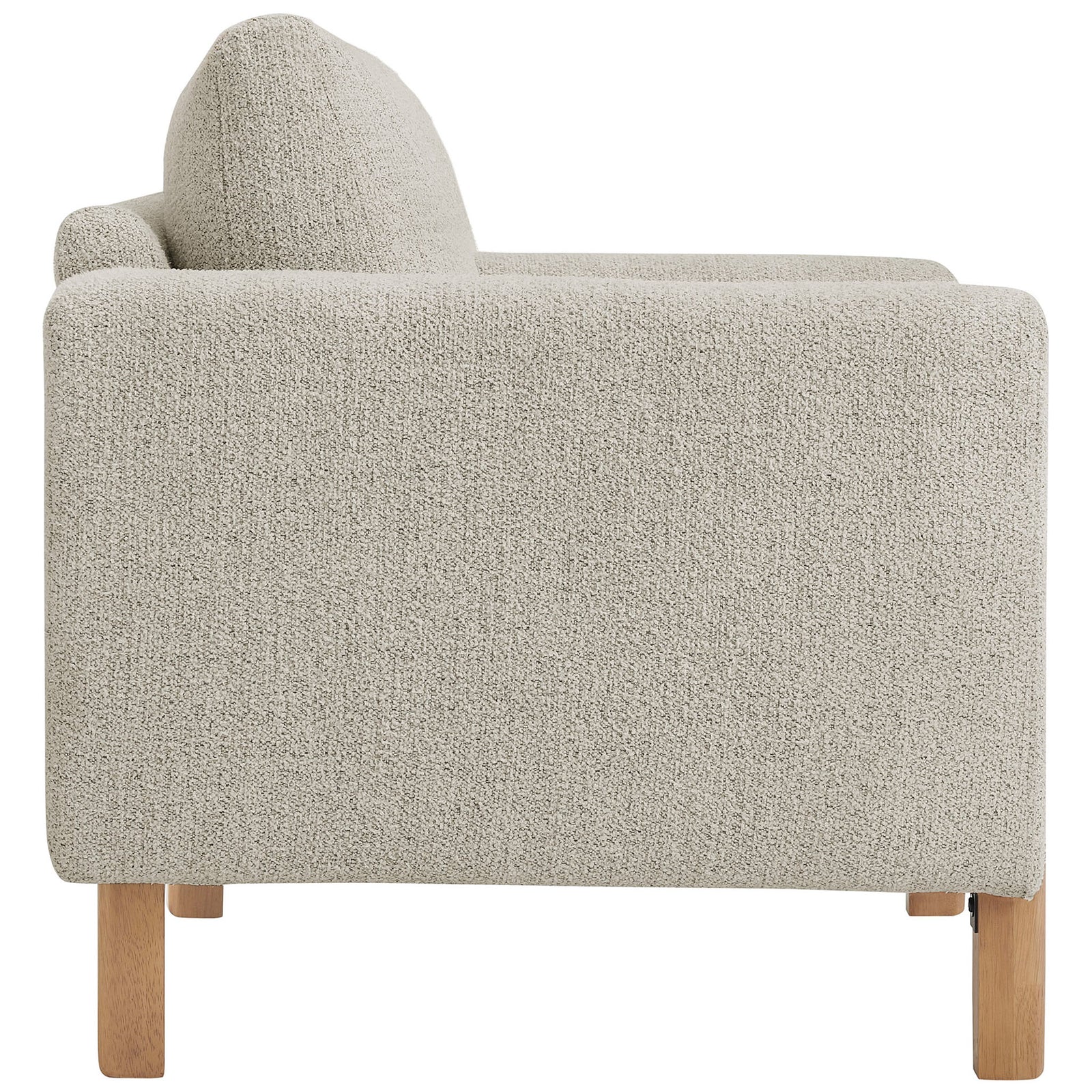 Sculpted profile with deep seat and thick, rounded arms wrapped in textured boucle upholstery || EEI-7459-PCH-BEE || side_studio