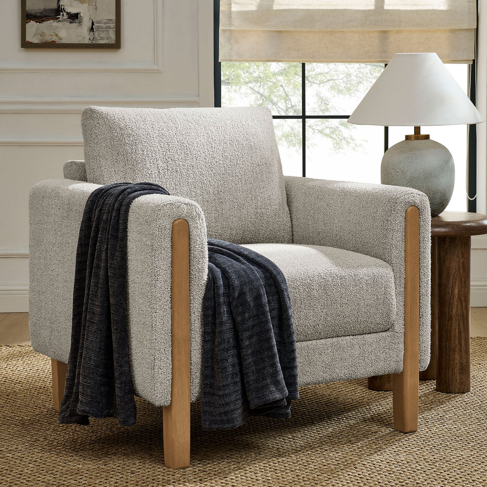 Modern boucle armchair with natural beech legs brings cozy texture and warmth to the living room || EEI-7459-PCH-BEE || front_angle_room