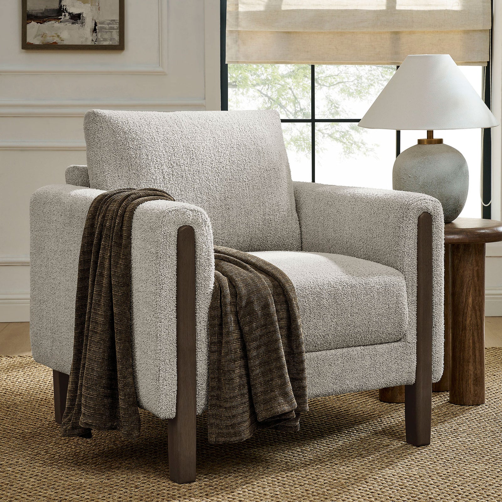 Styled for modern living with espresso wood legs, boucle fabric, and a draped throw for warmth. || EEI-7459-PCH-ESP || front_angle_room