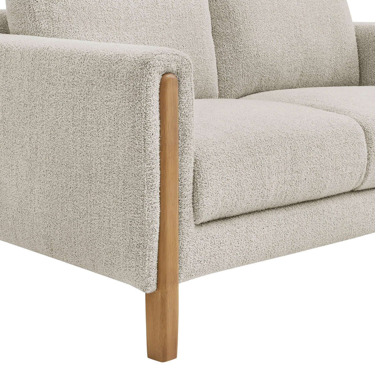 Boucle arm meets solid beech wood leg, highlighting warm contrast and tailored edge detail || EEI-7460-PCH-BEE || leg_studio