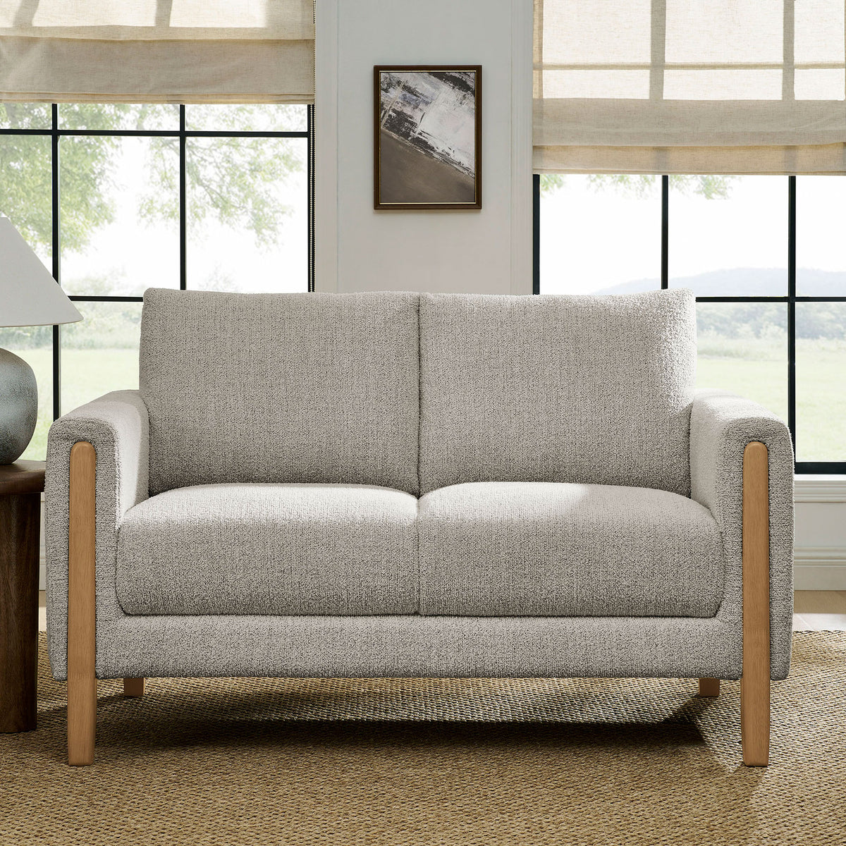Parchment boucle loveseat styled in a bright living room with beech legs and cozy neutral decor || EEI-7460-PCH-BEE || front_room