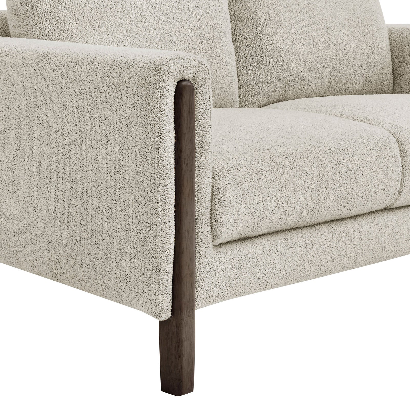 Boucle loveseat arm with espresso wood leg highlighting the soft textured upholstery and sleek trim || EEI-7460-PCH-ESP || leg_studio