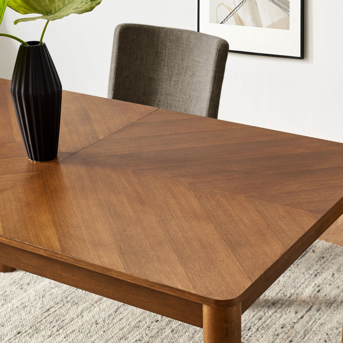 Styled tabletop shows the chevron wood pattern paired with modern decor in a bright dining room || EEI-7464-WAL || detail_room