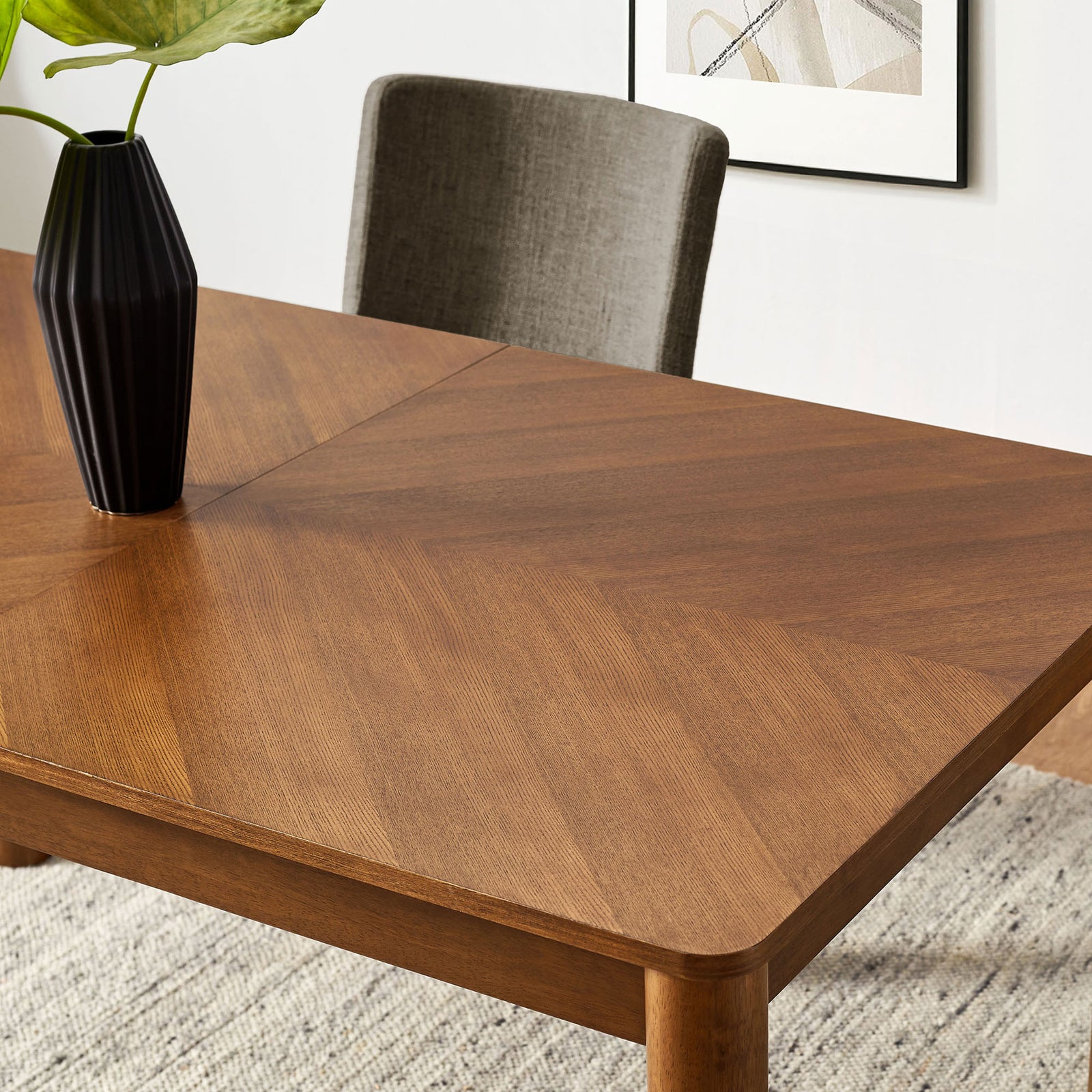 Styled tabletop shows the chevron wood pattern paired with modern decor in a bright dining room || EEI-7464-WAL || detail_room