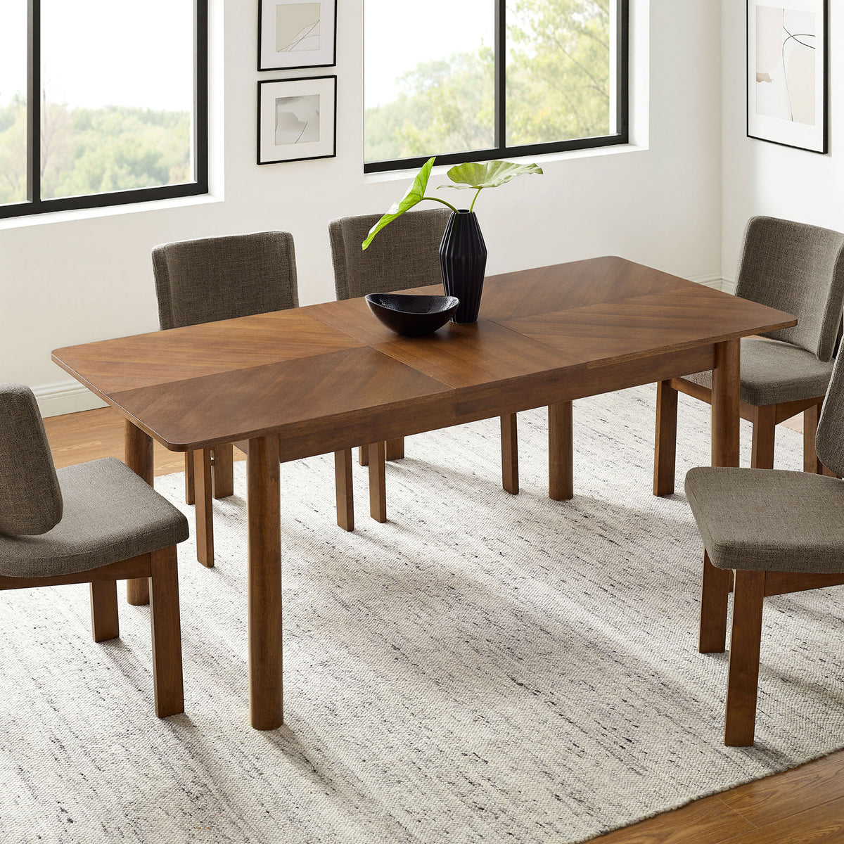 Alba dining table shown fully extended to seat six to eight guests in a light-filled dining room || EEI-7464-WAL || front_angle_converted_room