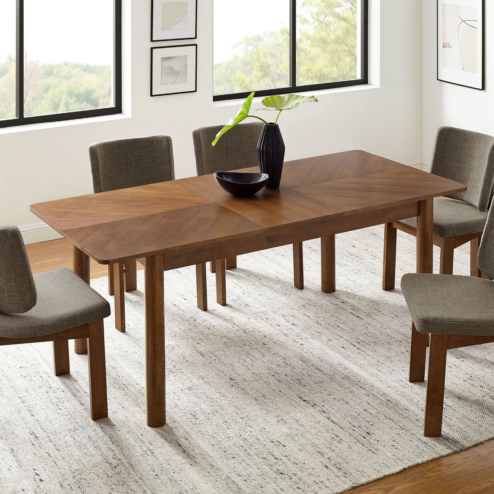 Alba dining table shown fully extended to seat six to eight guests in a light-filled dining room || EEI-7464-WAL || front_angle_converted_room
