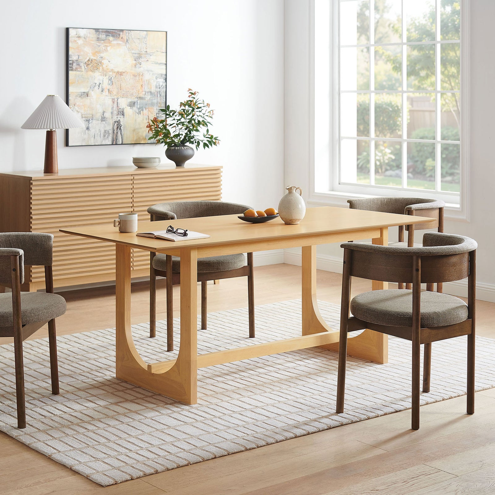 Ashcroft oak dining table anchoring a modern dining room with soft light and neutral accents || EEI-7466-OAK || front_angle_room