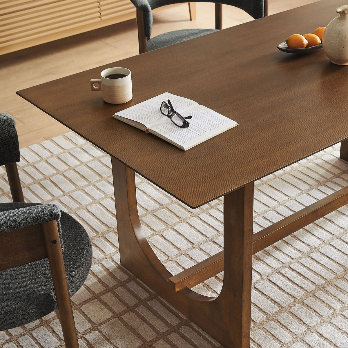 Walnut Ashcroft dining table styled with modern tableware, creating a warm, inviting everyday dining space || EEI-7466-WAL || front_angle_room