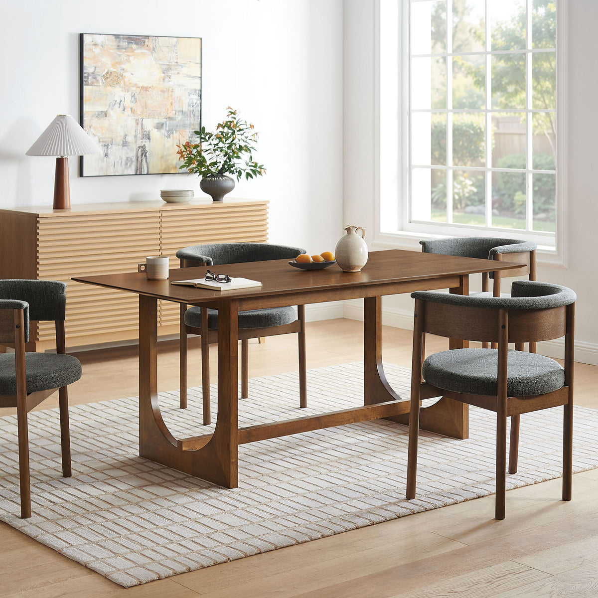 Ashcroft walnut dining table anchoring a bright, modern dining room with coordinating chairs and decor || EEI-7466-WAL || front_angle_room